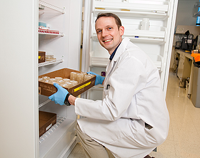 scientist getting samples from the freezer
