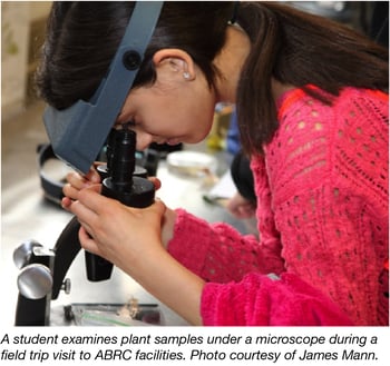 Student Examining Plant sample under .a microscope at ABRC