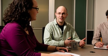 Two people at a meeting